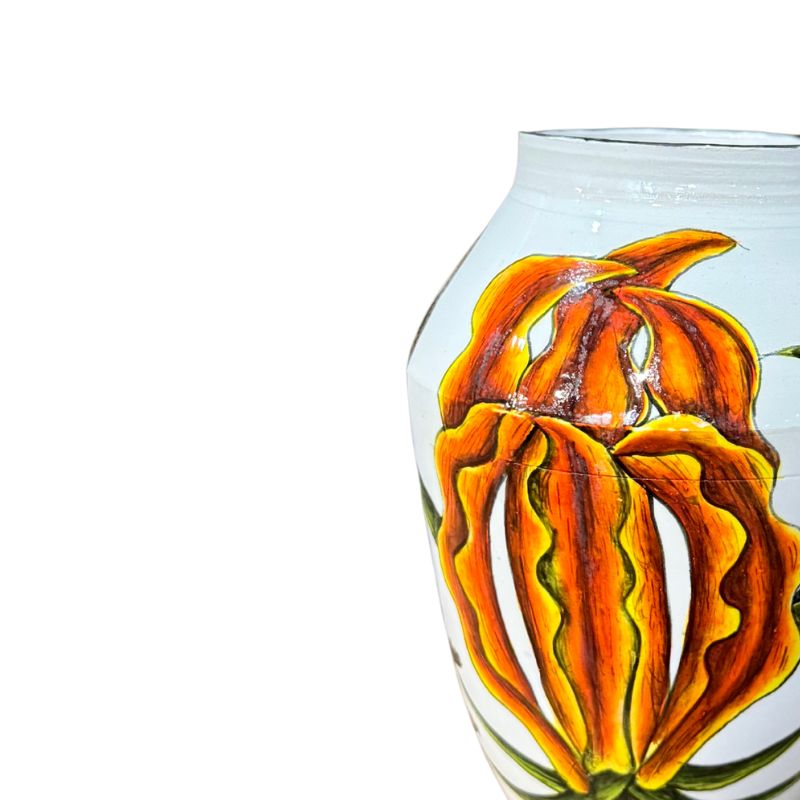 Decorative glass vase with a floral design on a white background