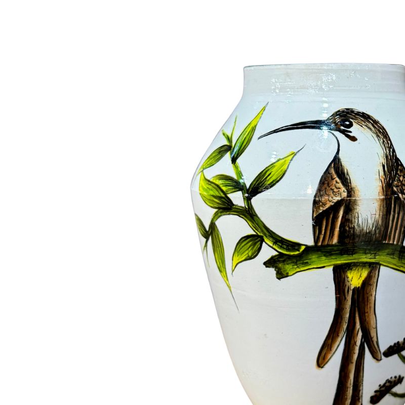 Vase with a bird and branch design on a white background