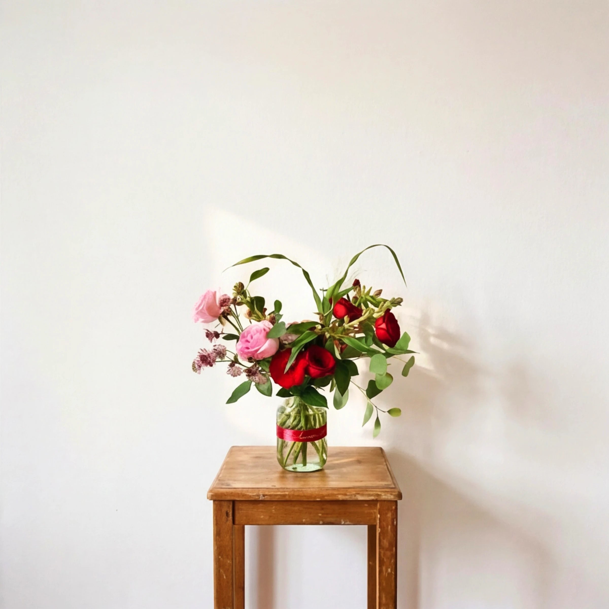 Long-stem view of the Vibrant Rose Bouquet by Fabulous Flowers South Africa, hand-tied 45 multicoloured roses with fresh-cut stems for same-day Cape Town and Johannesburg delivery