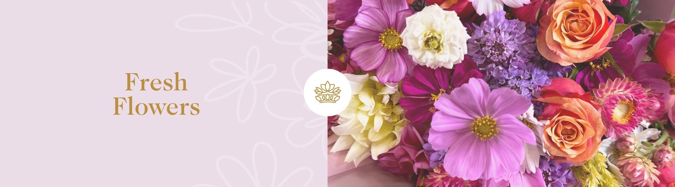 Vibrant bouquet of fresh flowers, including roses and cosmos. Perfect for adding elegance to any occasion or as a gift.