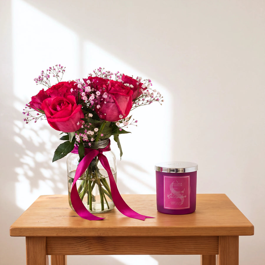 Fuchsia Flame hot pink roses with pink baby's breath and Tropical Watermelon candle