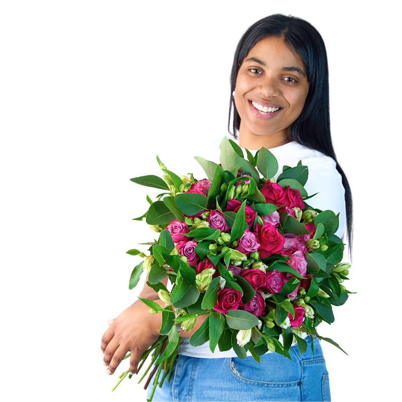 Woman holding a bouquet of pink and green flowers on a white background
