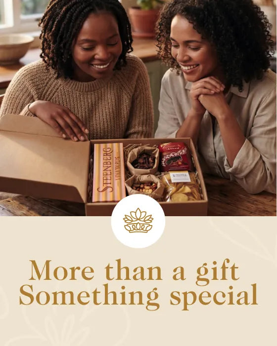Two women opening a gift box together with a brand logo and text overlay.