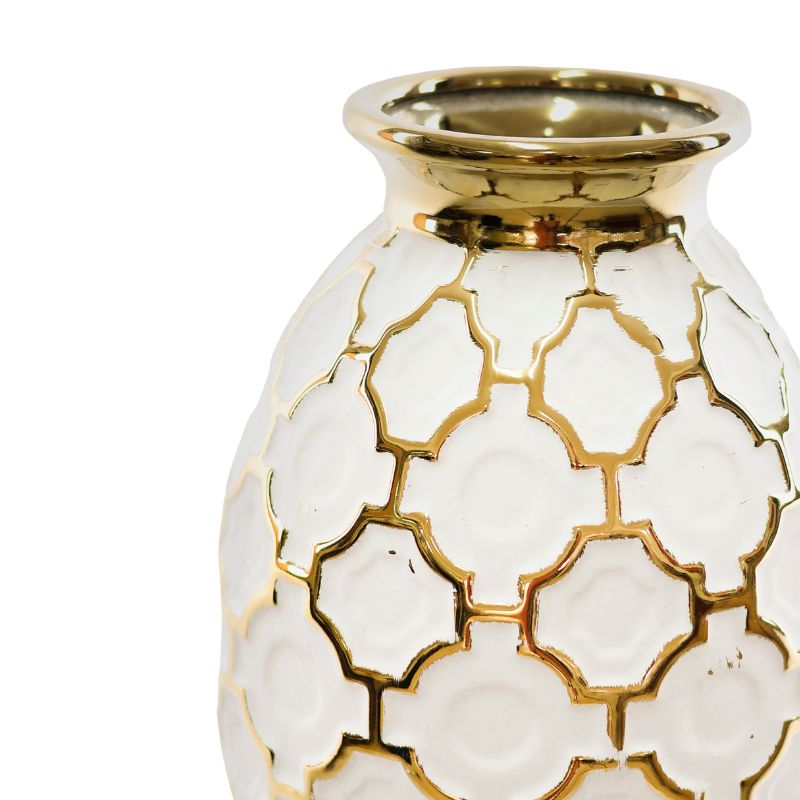 White vase with gold geometric patterns on a white background