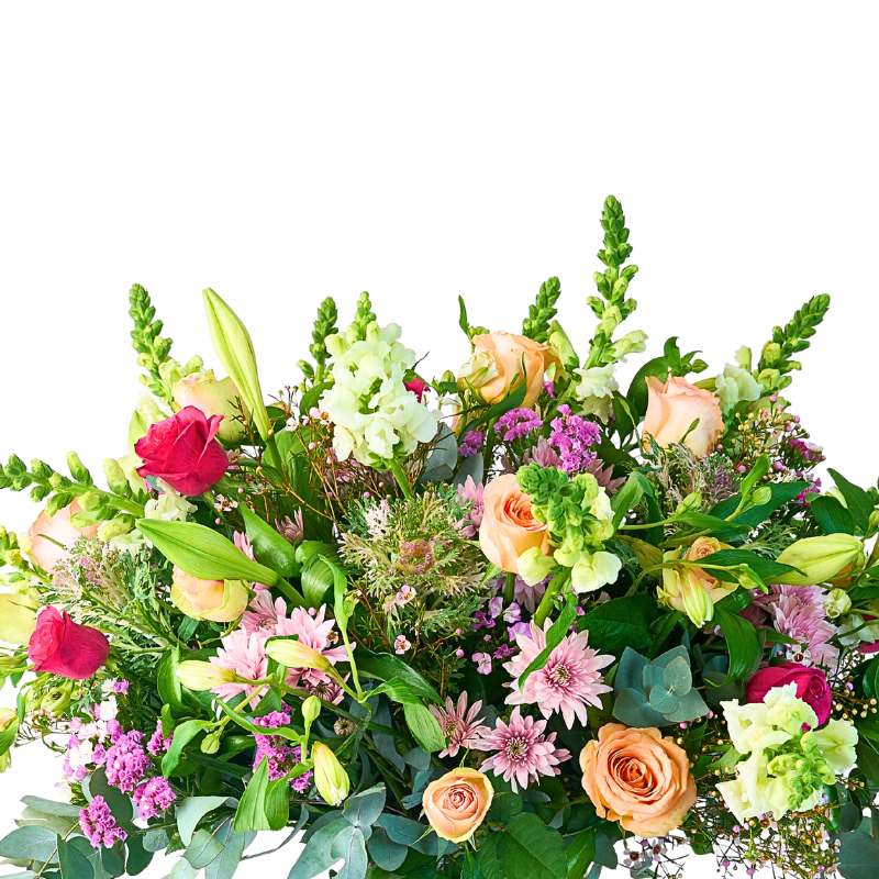 Close-up of Grand and Colourful Flower Arrangement showing a pink rose, buds and fresh seasonal foliage