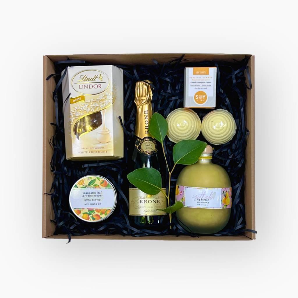 Elegant hamper with premium chocolates, sparkling wine, and self-care products - Fabulous Flowers