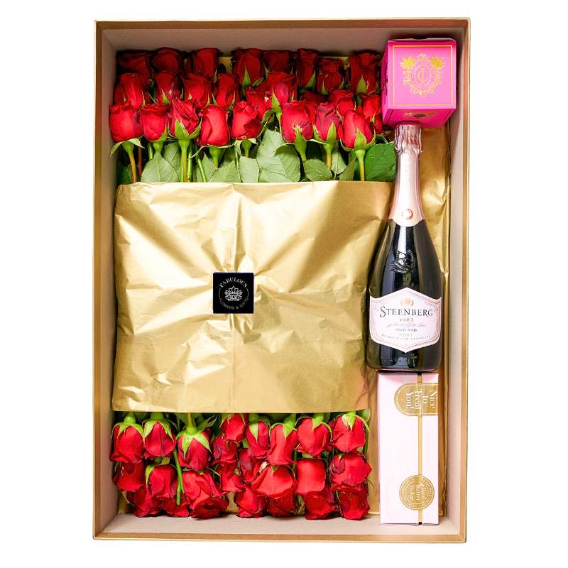Her Majesty's Gift Box with 50 red roses, Steenberg Cap Classique, Cape Island candle and Frank & Olive fudge in a luxe gift box
