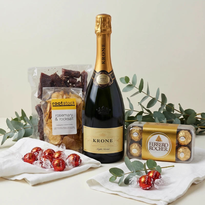Krone Crisp Exquisite Snack Hamper styled with Krone Night Nectar, biltong, Rootstock rosemary chips, Ferrero Rocher and Lindt Lindor, Fabulous Flowers and Gifts