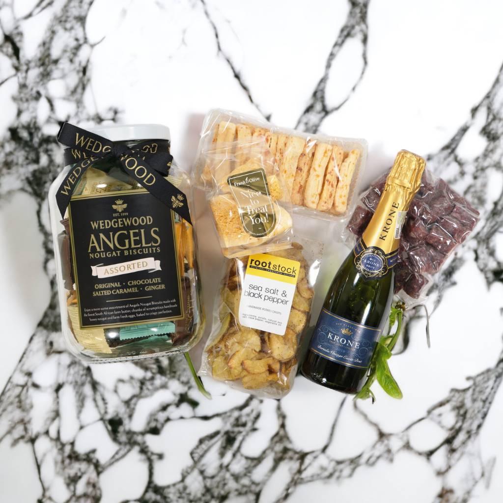 A delicious snack hamper with Wedgewood Nougat Biscuits and Iridescent Krone Borealis Bottle - Fabulous Flowers