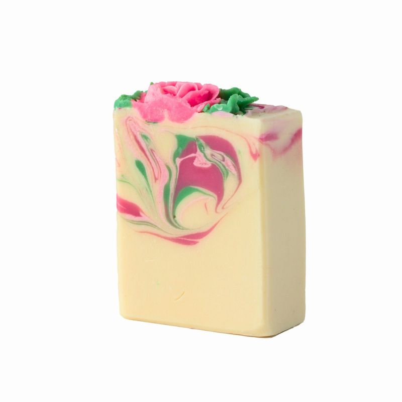 Handcrafted La Rose soap featuring a bright sculpted rose and swirling pink and green accents