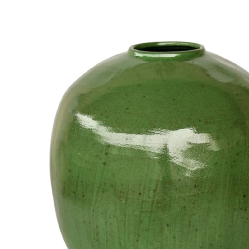 Green ceramic vase on a white background