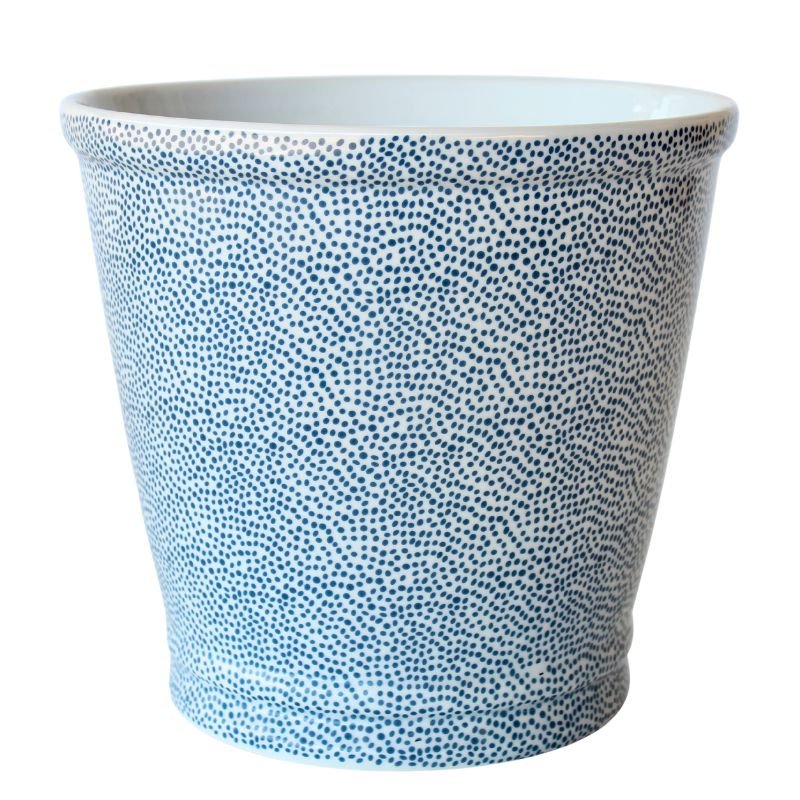 Ceramic planter with blue dot pattern on a white background