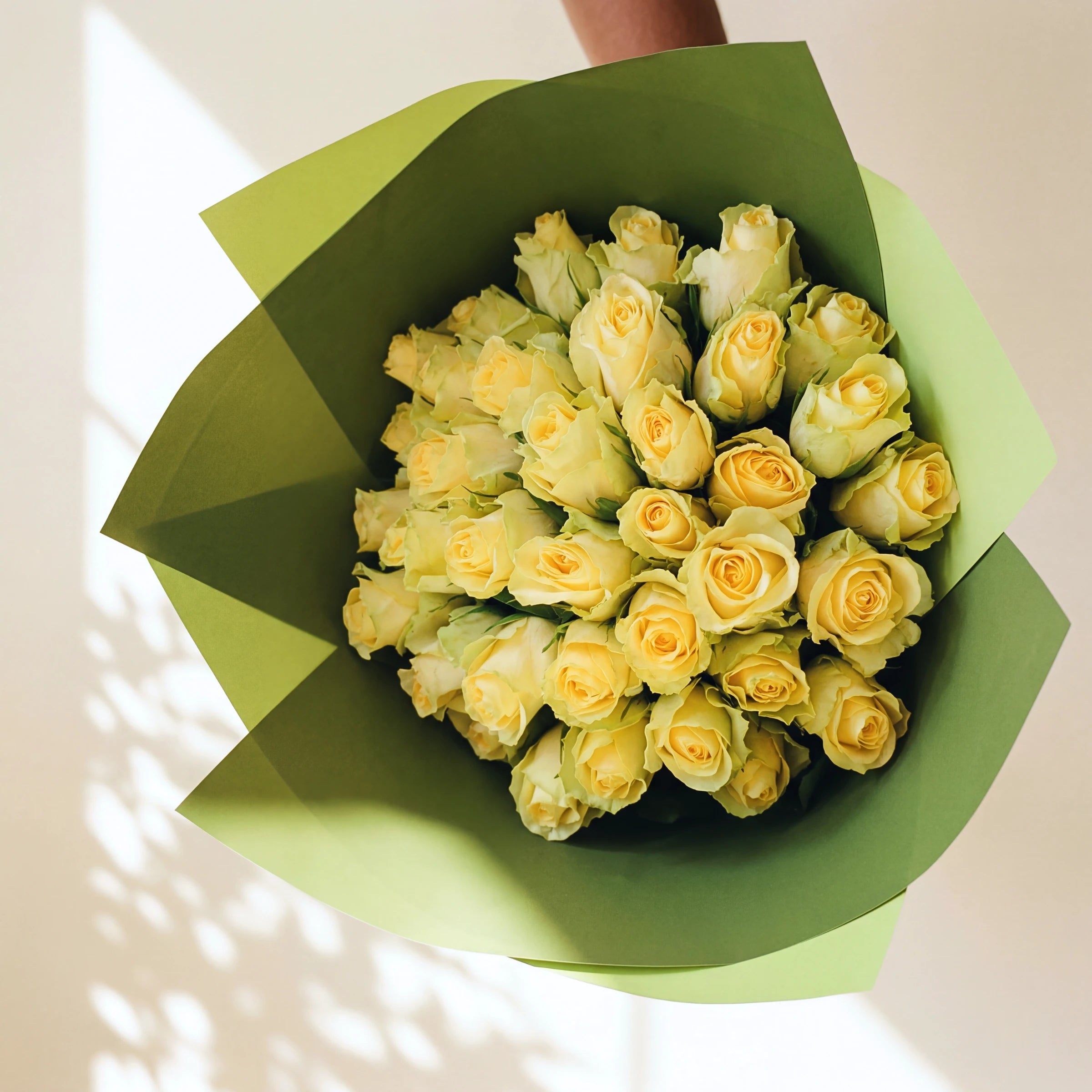 Three dozen pale yellow roses, the large Lemon Drop bouquet from above in green wrap