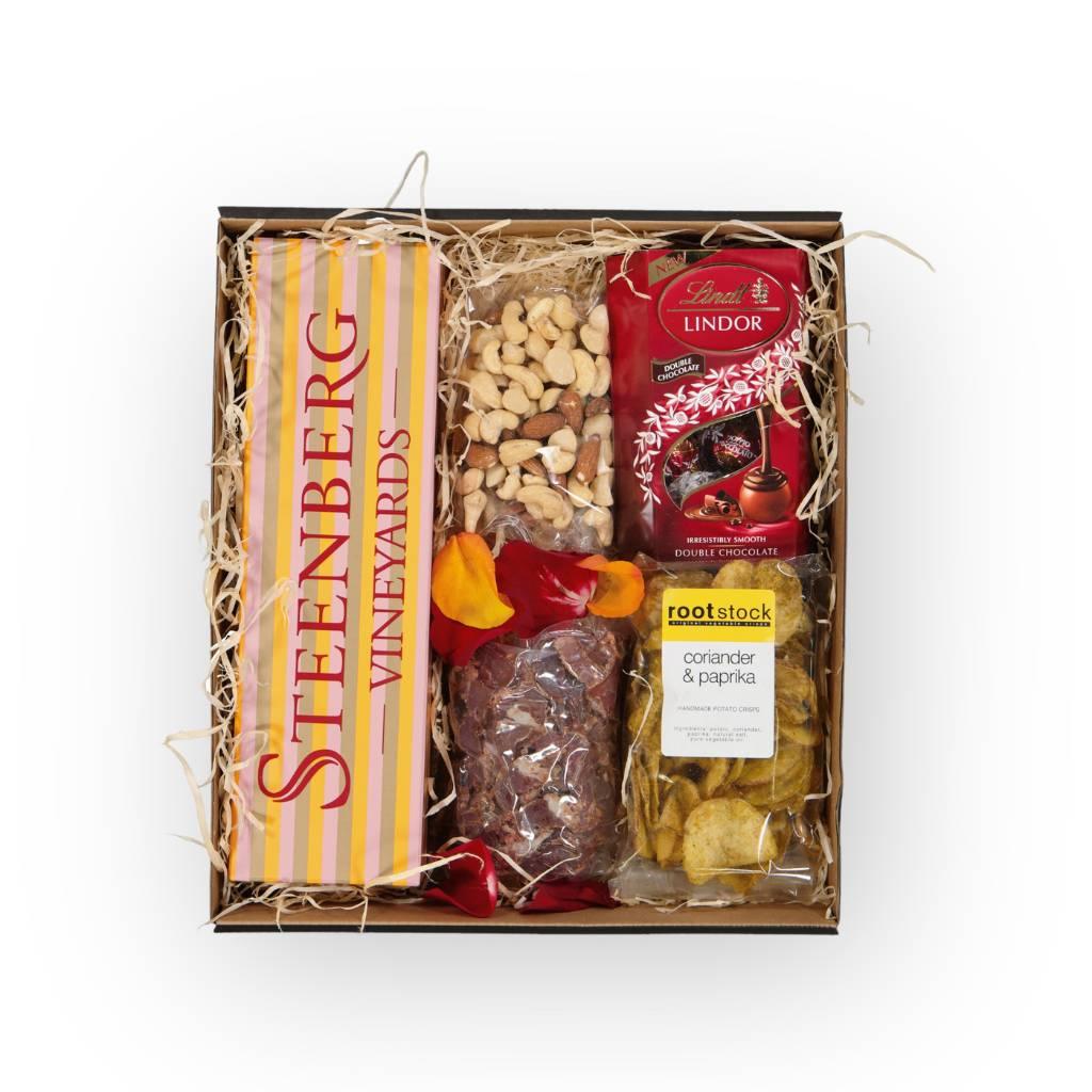 Luxury gift hampers filled with snacks like biltong, crips, Steenberg bubbly and Lindt chocolate for nationwide delivery in South Africa via courier - Fabulous Flowers