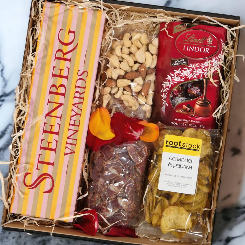 Luxury gift hampers filled with snacks like biltong, crips, Steenberg bubbly and Lindt chocolate for nationwide delivery in South Africa via courier - Fabulous Flowers