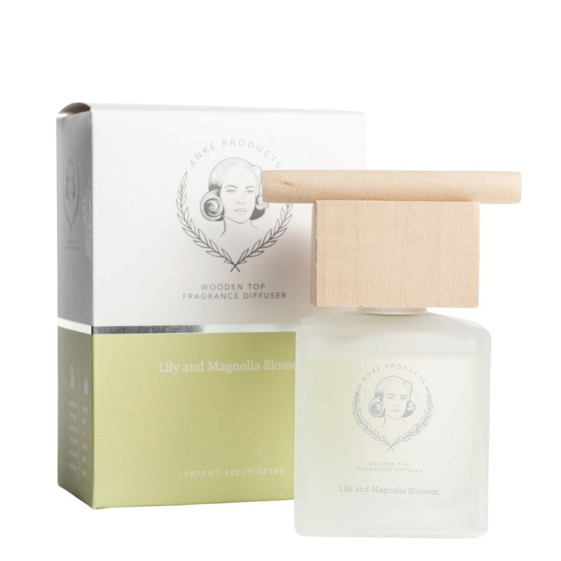 Fragrance diffuser with wooden top and packaging on a white background