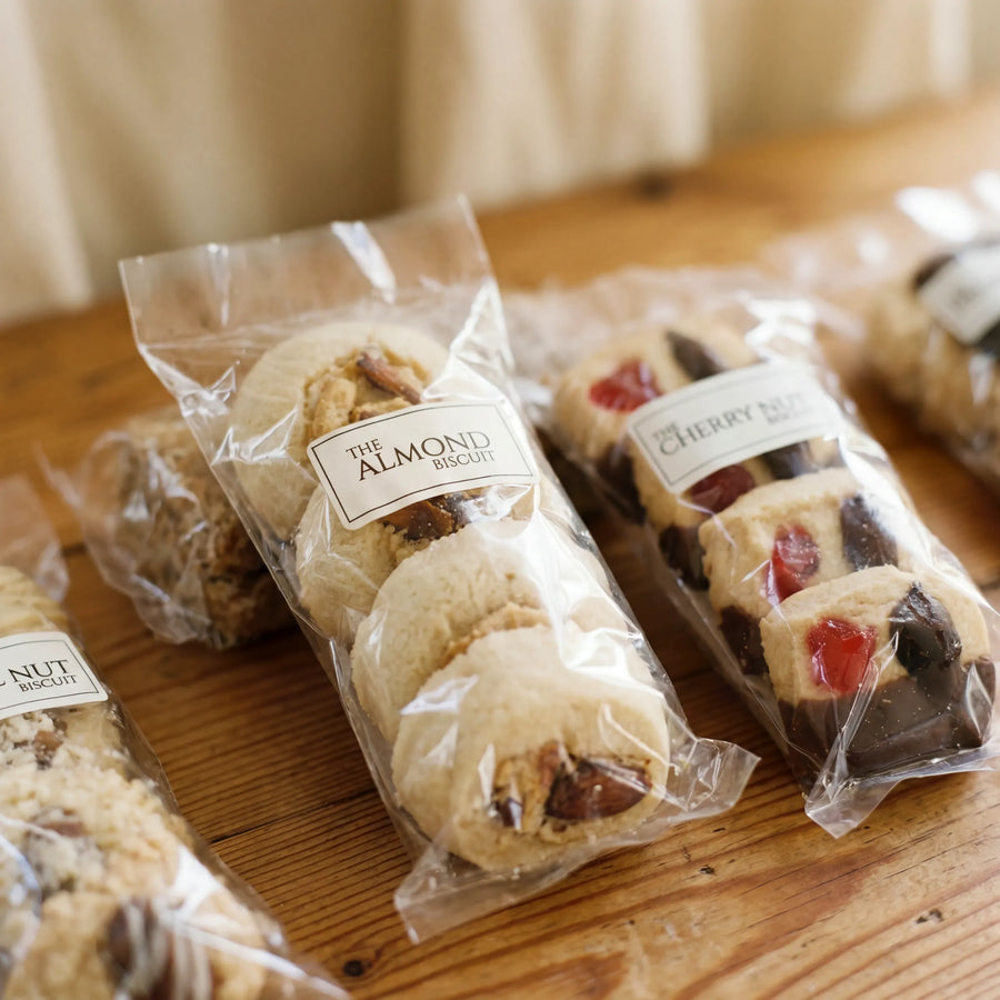 Close-up of Almond Biscuit and Cherry Nut Biscuit sleeves from the Luxury Biscuits Small box by Fabulous Flowers