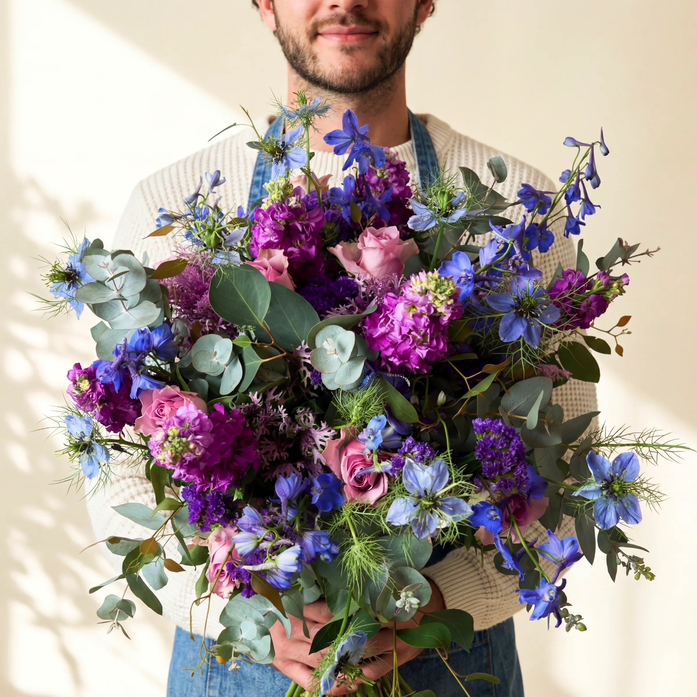 Luxury lavender garden bouquet of lilac roses, purple stock, blue delphinium and nigella, hand-tied by Fabulous Flowers