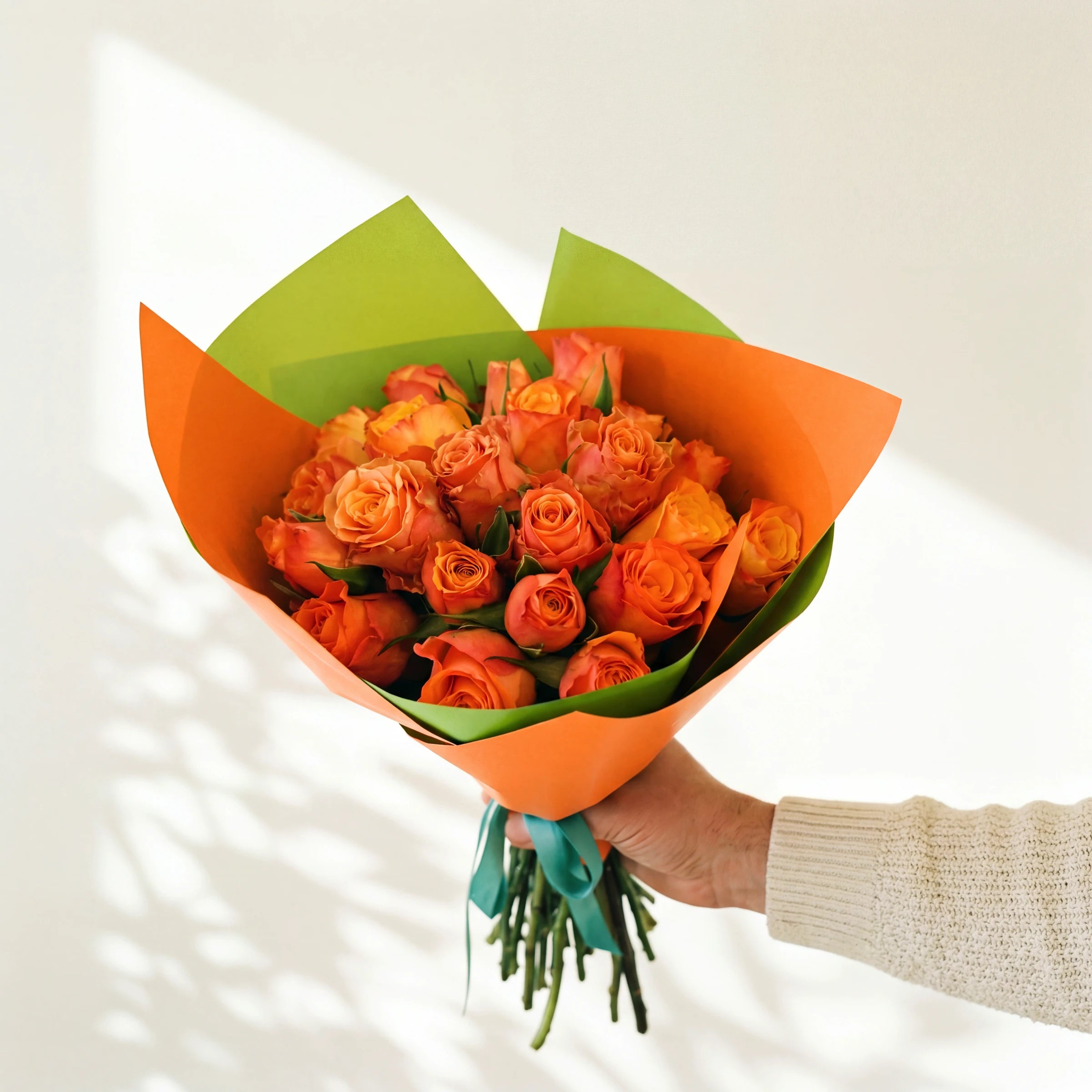 The Marmalade bouquet, two dozen bright orange roses in orange and lime wrap, same-day Cape Town and Joburg