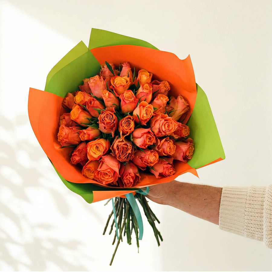 The largest Marmalade, three dozen bright orange roses in orange and lime green wrap, by Fabulous Flowers