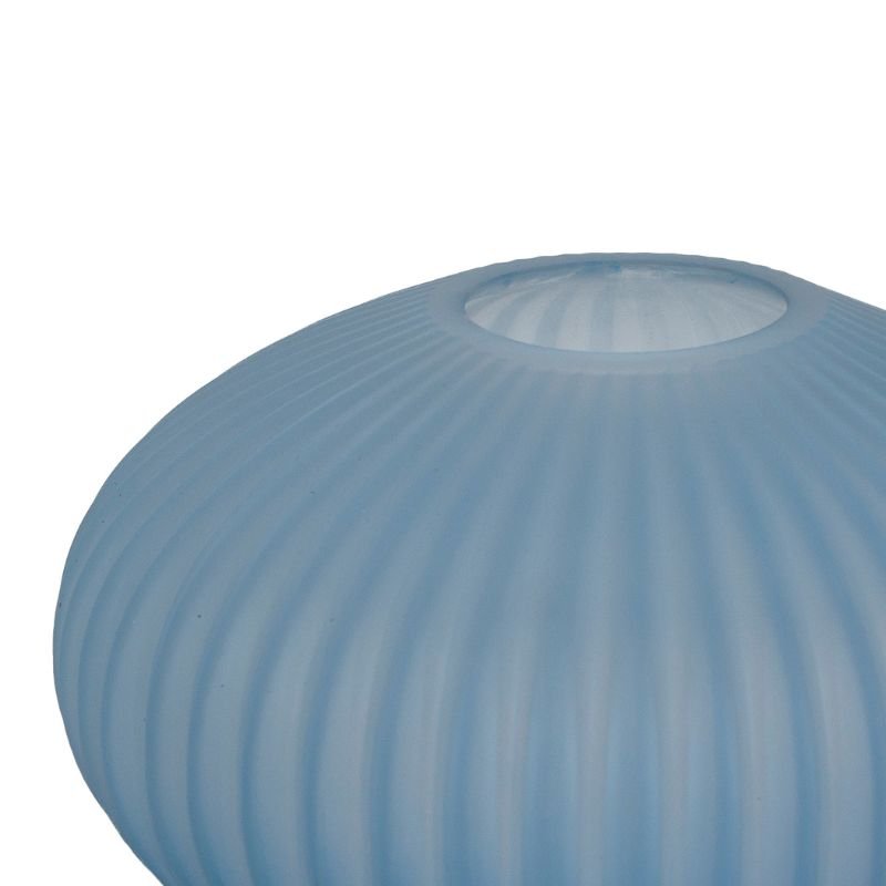 Blue ribbed glass vase on a white background