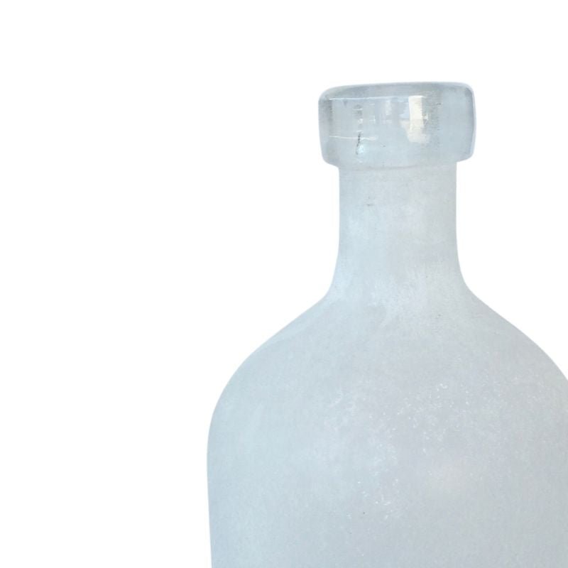 Clear glass bottle on a white background