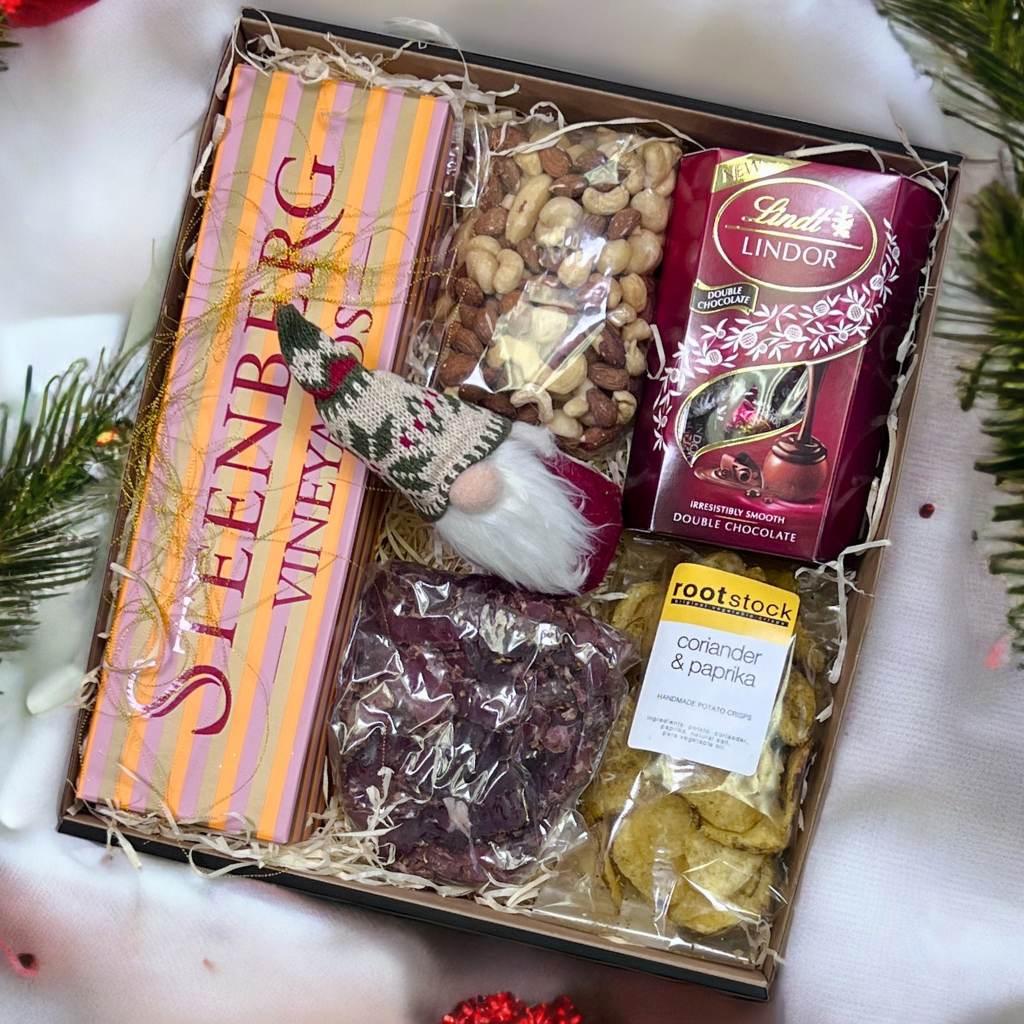 Merry Moments gift hamper with Steenberg bubbly, biltong, chocolate and a santa Christmas decoration - Fabulous Flowers