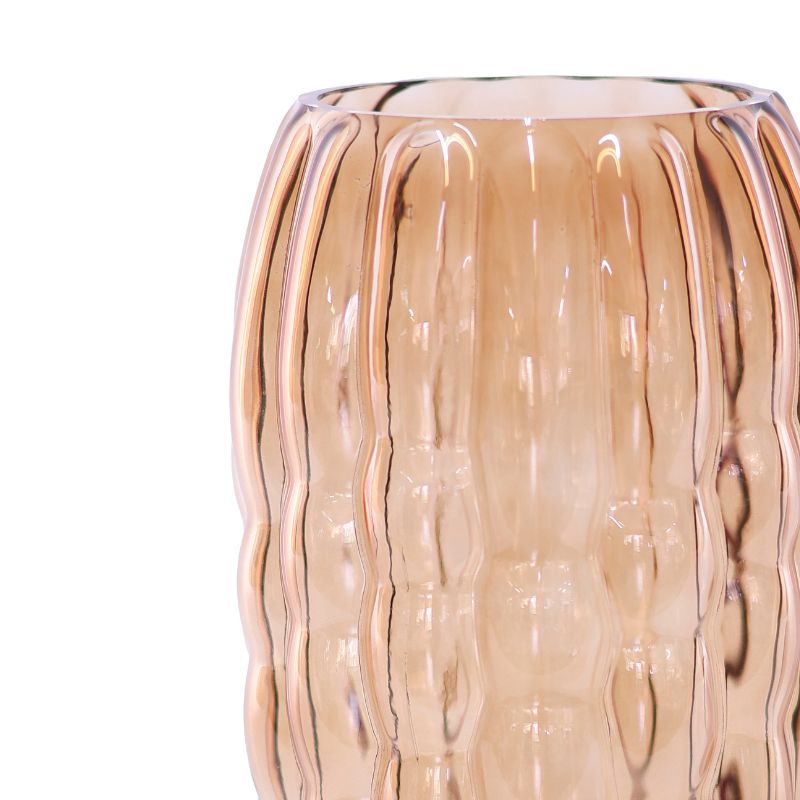 Glass vase with wavy texture on a white background