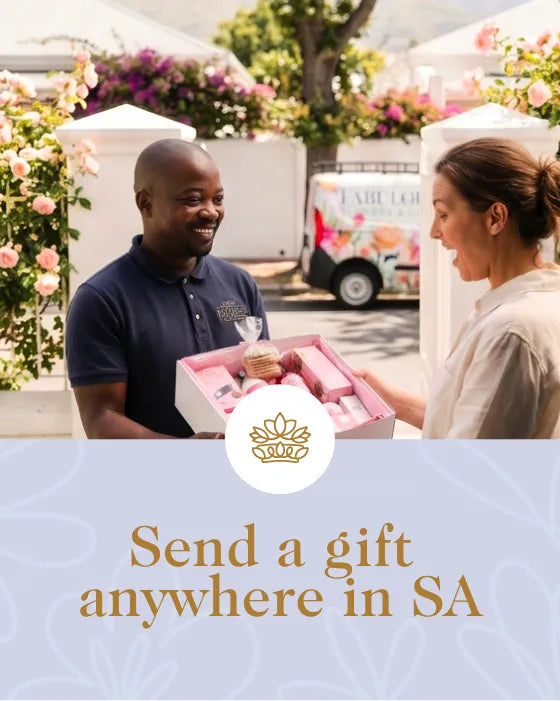 Man and woman exchanging a gift box with a floral truck in the background, featuring text 'Send a gift anywhere in SA'.
