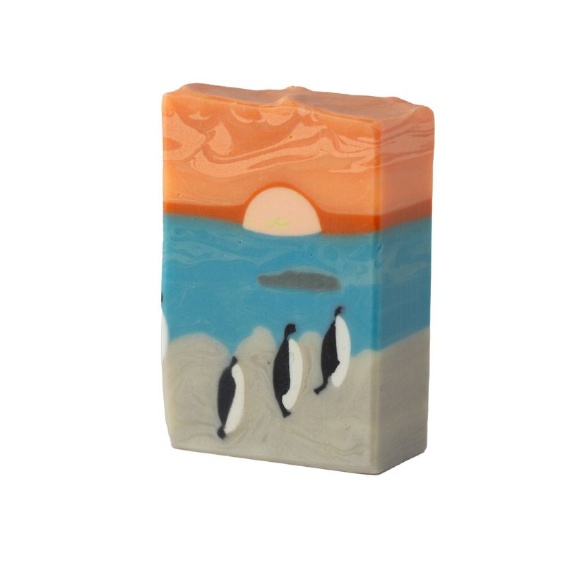 Handcrafted Penguin’s Cove soap with penguin beach scene at sunset, available at Fabulous Flowers & Gifts