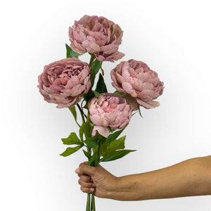 Peony Mauve Artificial Flower Stems being held by florist - Fabulous Flowers and Gifts