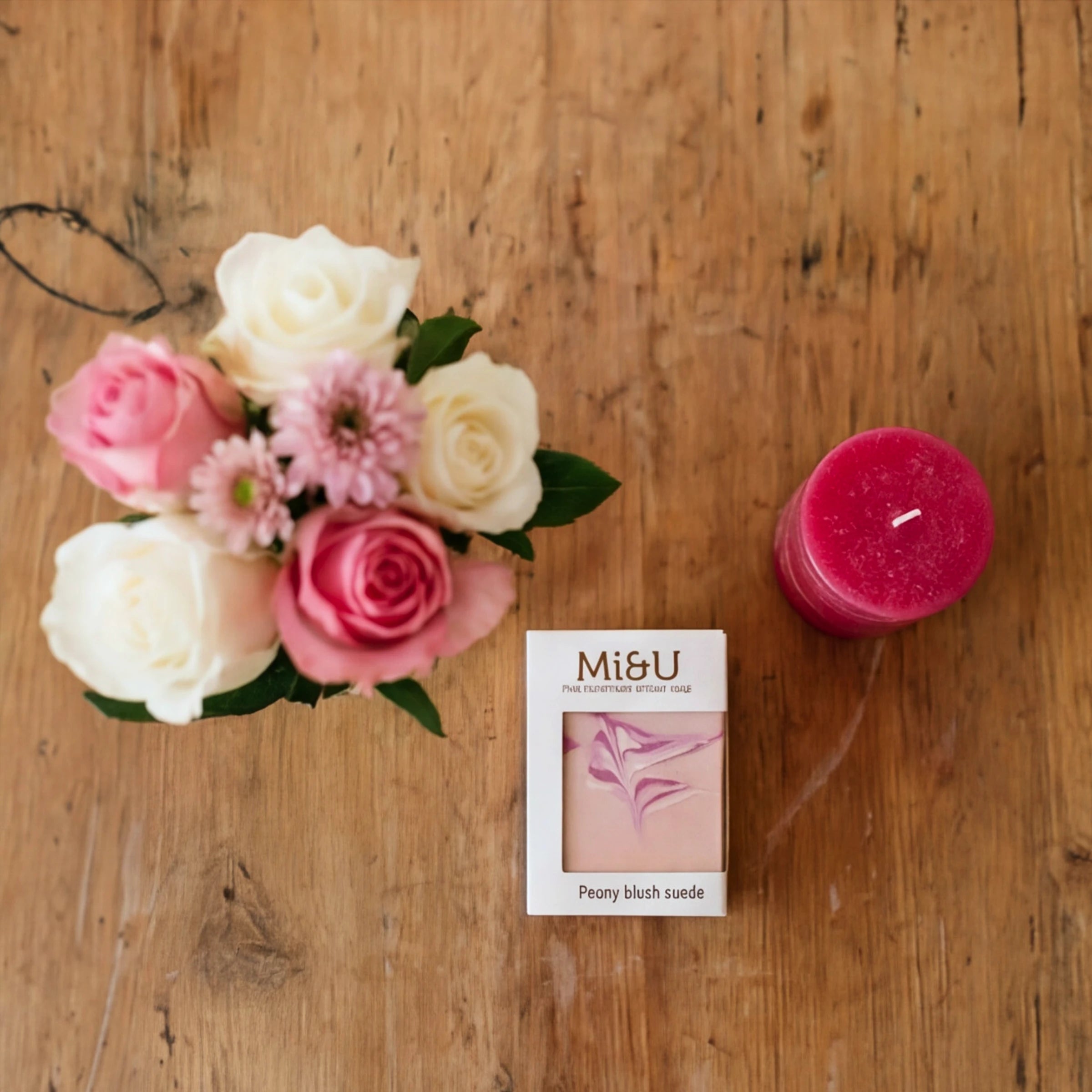 Top-down view of the Petal & Flame set, rose posy, Mi&U soap and a hot pink candle