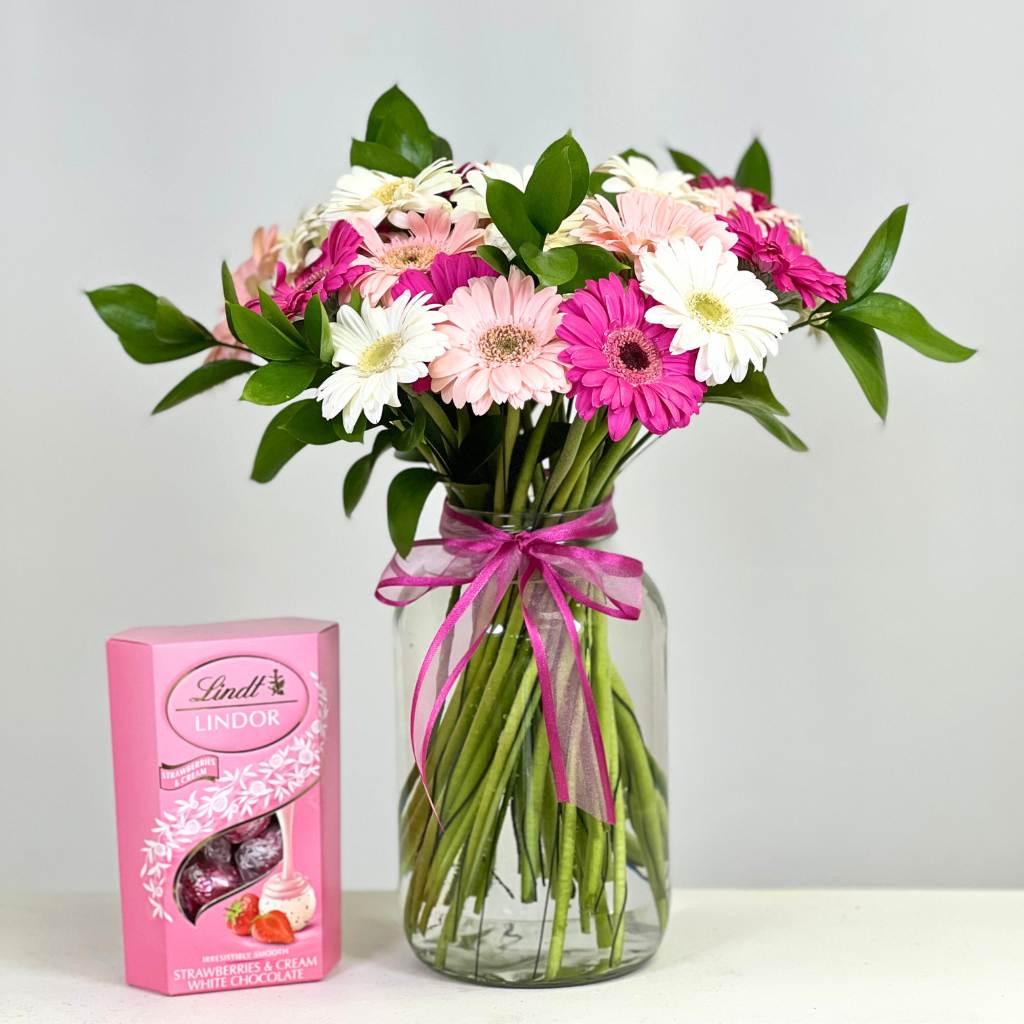 Pink-a-Boo Gerbera Blossom Arrangement with Lindt Strawberries and Cream chocolates - Fabulous Flowers