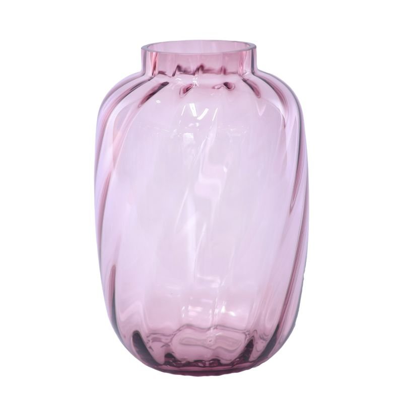 Pink glass vase on a white background