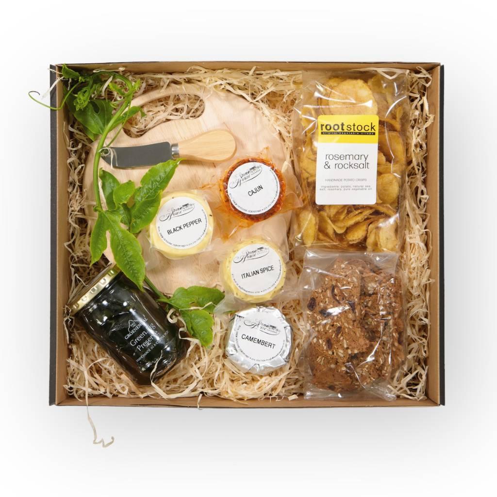 Scrumptious snack items like Picnic board and cheese knife, Rootstock Rosemary & Rocksalt Crisps, Green Fig Preserve, Karoo crackers, Mini Black Peper, Cajun, Italian Spice and Camembert Cheese Wheels for your picnic basket - Fabulous Flowers