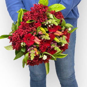 Close-up of Red Petal Poetry Bouquet featuring red roses and gerberas - Fabulous Flowers