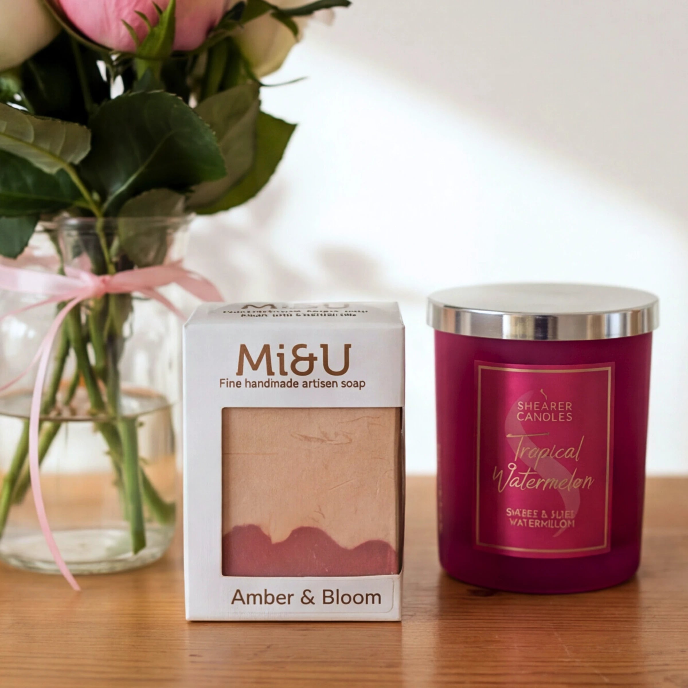 Mi&U Amber & Bloom soap and Shearer Tropical Watermelon candle from the Rose & Ember set, roses behind