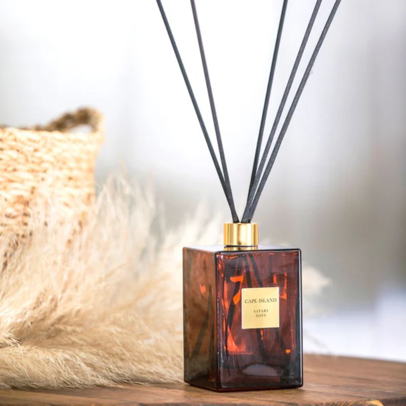 Cape Island diffuser with black reeds on a wooden surface