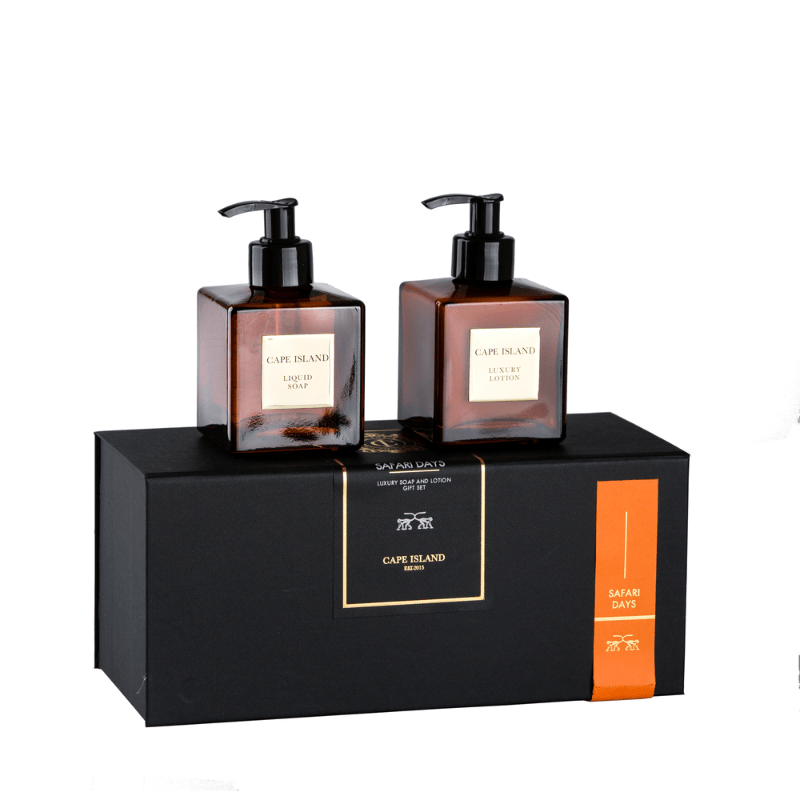 Two bottles of Cape Island body wash on a black stand with an orange label.