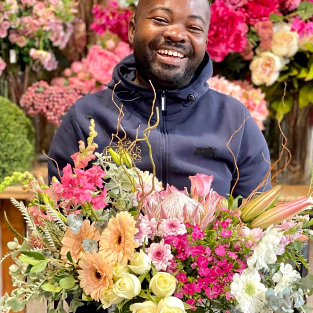 amazing driver holding fresh flowers for cape town same day delivery