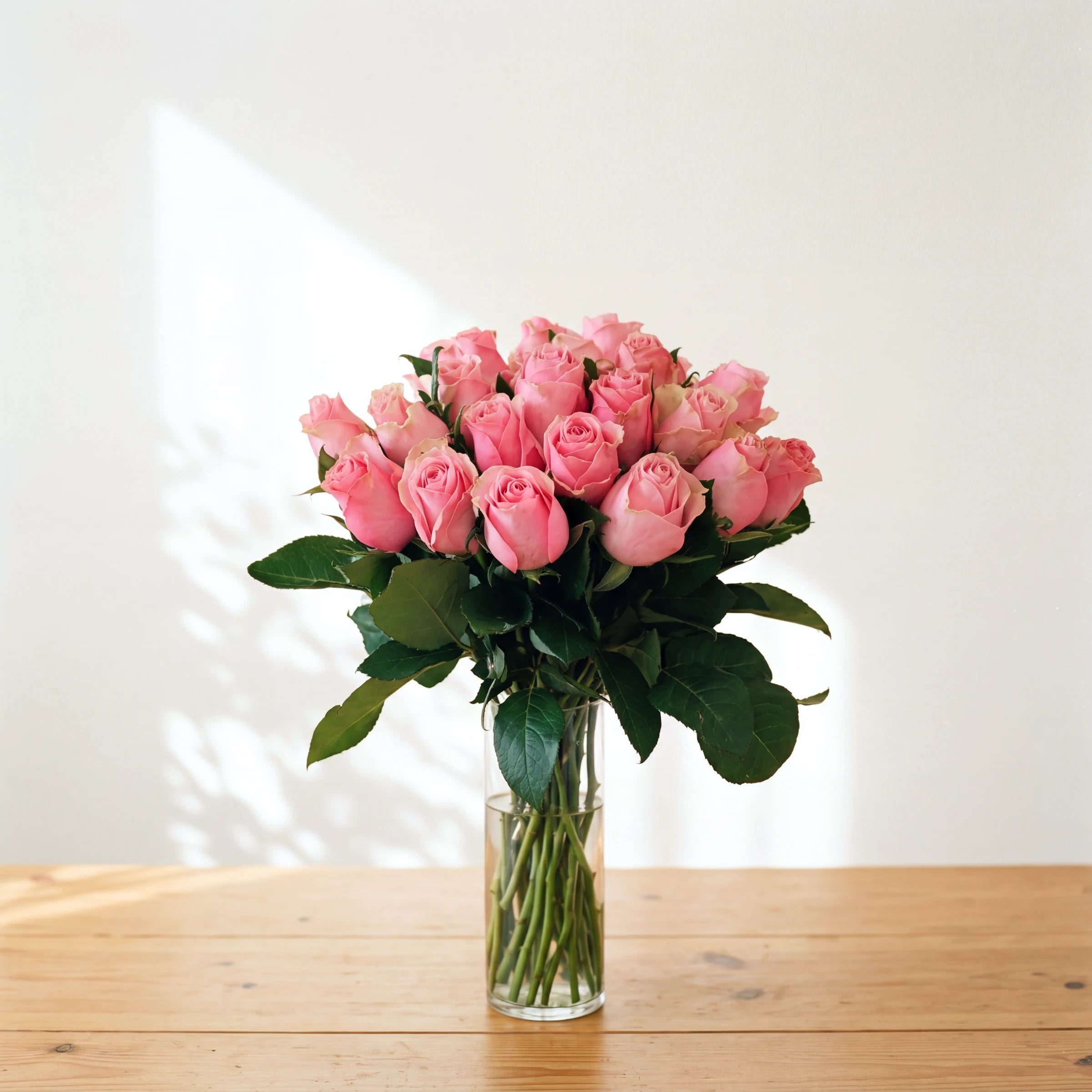 The medium Sherbert, two dozen pink roses arranged in a glass vase, same-day in Cape Town and Joburg
