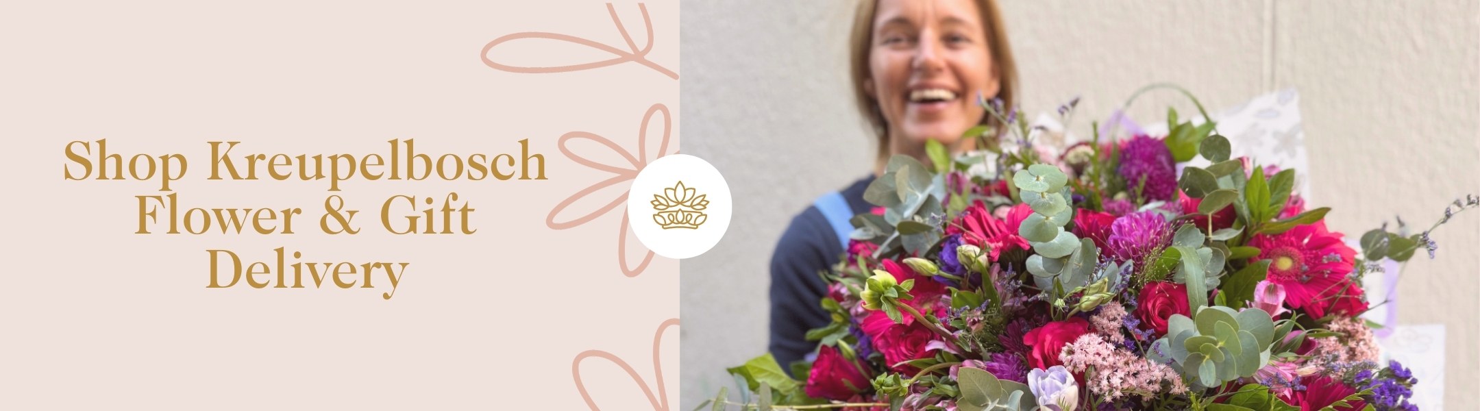 Shop Kreupelbosch Flower & Gift Delivery - joyful florist with lush bouquet of roses, gerberas, eucalyptus, and fresh florals.