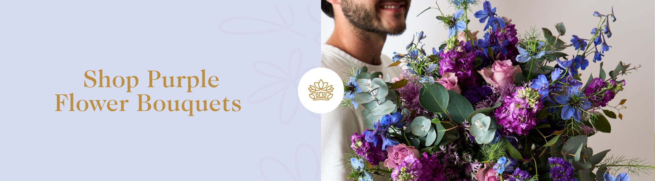 Man holding a lush purple and blue bouquet – Shop Purple Flower Bouquets from Fabulous Flowers and Gifts for bold, elegant beauty. 