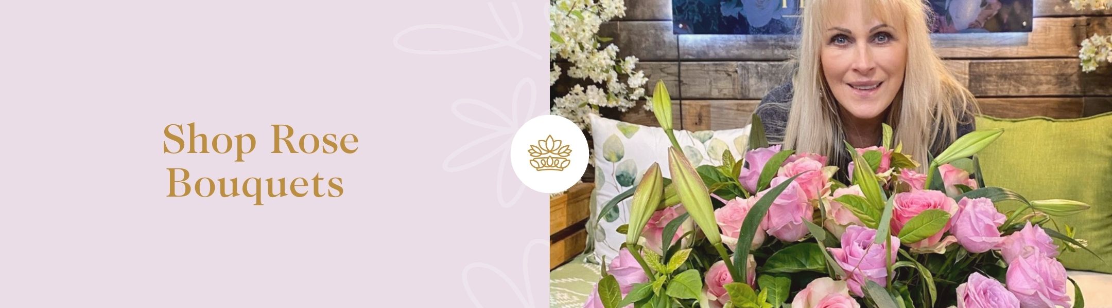 Shop Rose Bouquets - Fabulous Flowers and Gifts featuring a smiling woman with a large bouquet of pink roses and green buds indoors.