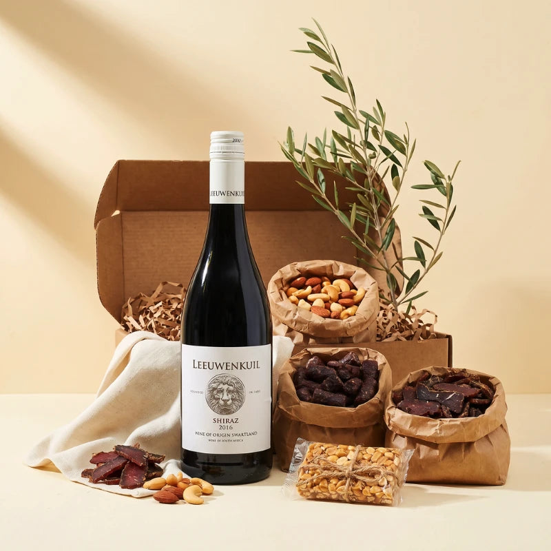 Simply Scrumptious snack gift box for him styled with Leeuwenkuil Shiraz, biltong, droëwors, mixed nuts and peanut brittle, Fabulous Flowers and Gifts