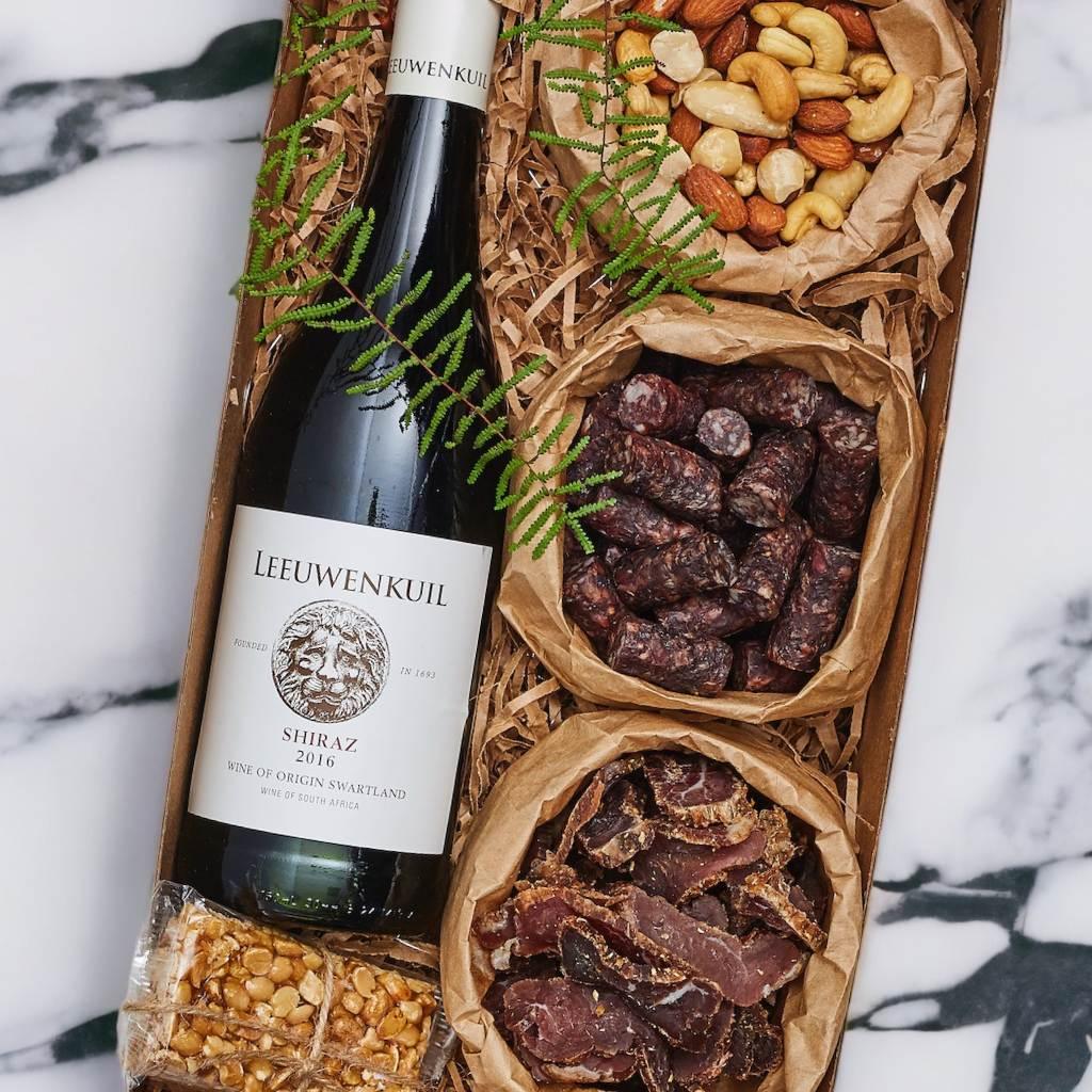 Simply Scrumptious Snack Gift Box packed with mixed nuts, biltong, droewors, peanut brittle and Leeuwenkuil Shiraz red wine - Fabulous Flowers