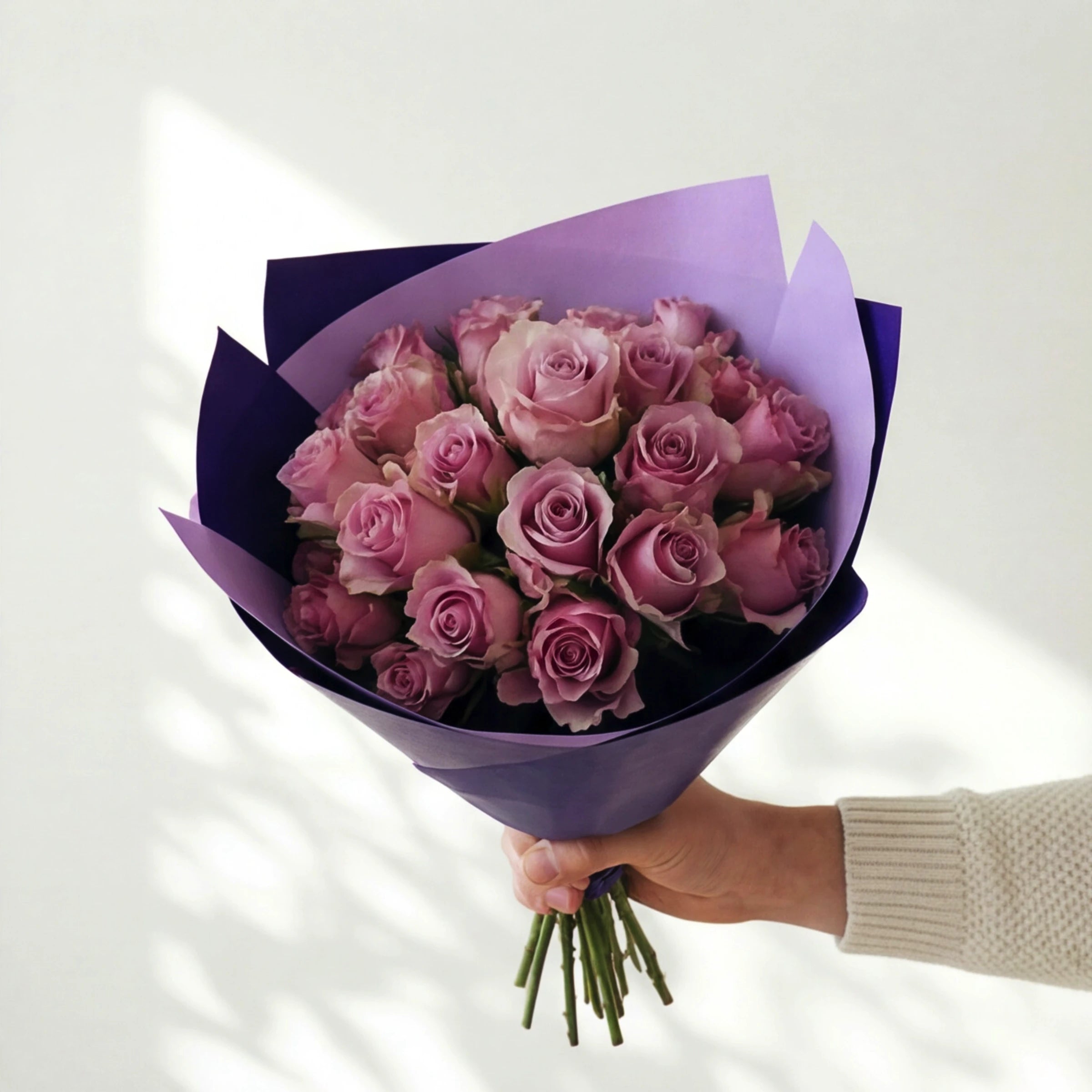 The Smitten bouquet, two dozen lavender roses in two-tone purple wrap, same-day in Cape Town and Joburg