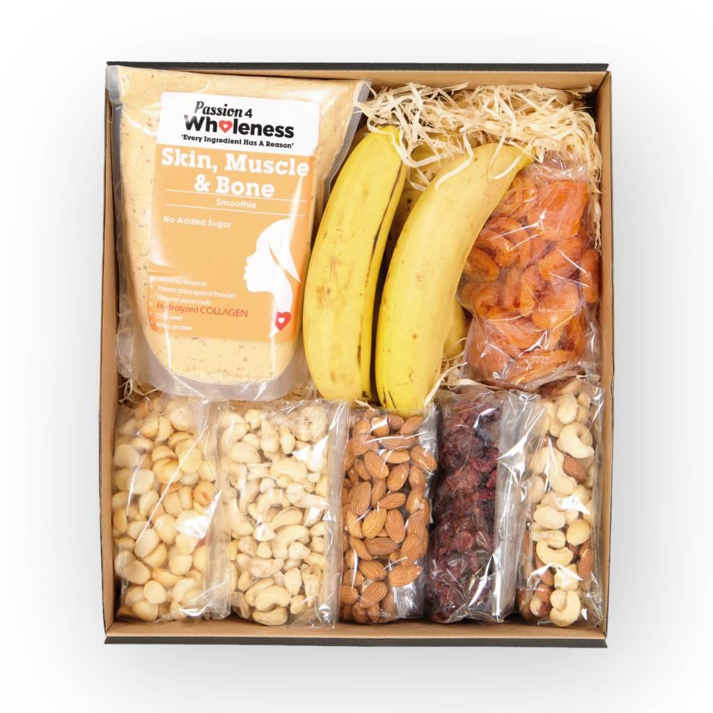 Gourmet snack hamper filled with diverse nutty delights, dried fruit and a smoothie mix - Fabulous Flowers