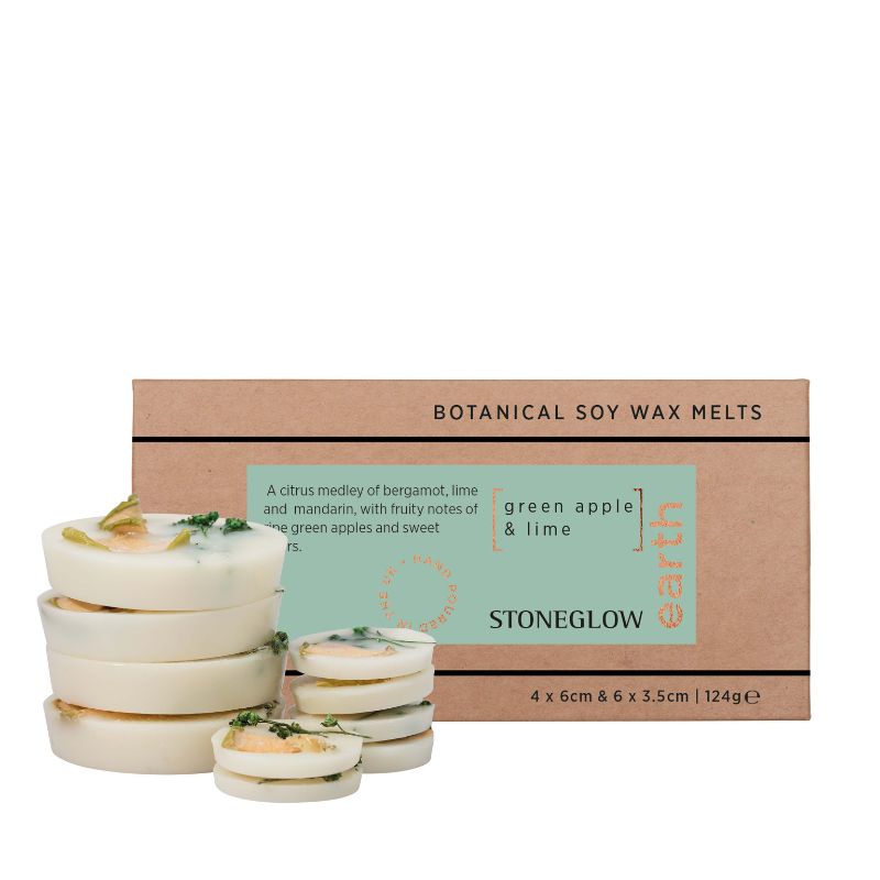 Stack of wax melts with a cardboard packaging box featuring Stoneglow branding on a white background.