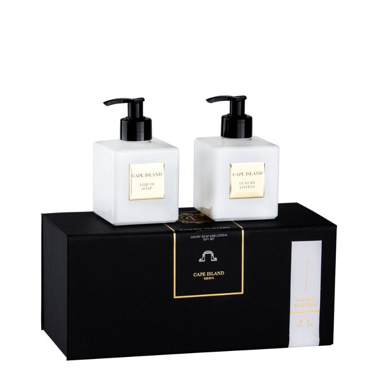 Two bottles of Cape Island lotion on a black box with the brand name displayed.